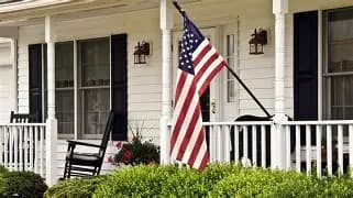 American flag on a house porch